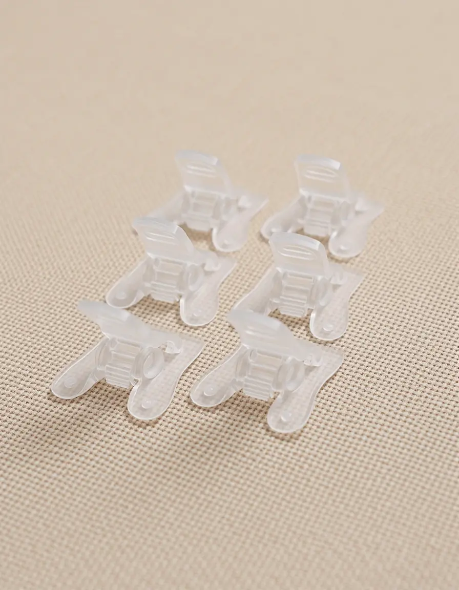 Clips de plástico para sujetar manteles en mesas de cocina